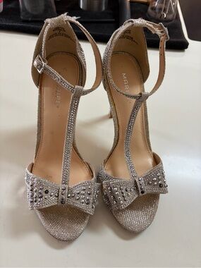 Maripe Glitter Champagne T-Strap Bow Heels with Stud Accents